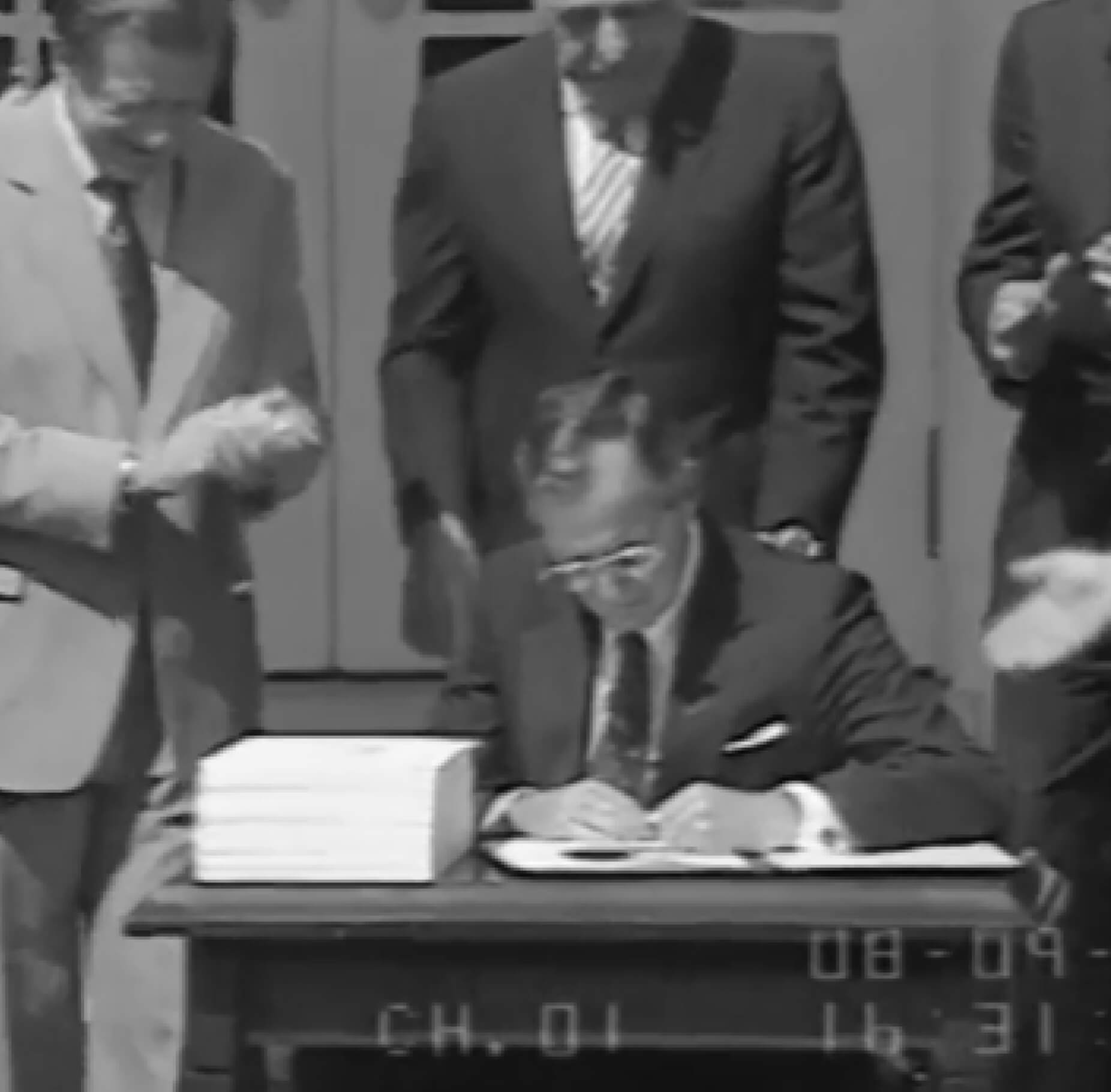 Background image: President George H. W. Bush signs the Financial Institutions Reform