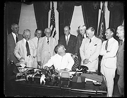 Photo of President Roosevelt signing the Banking Act of 1935