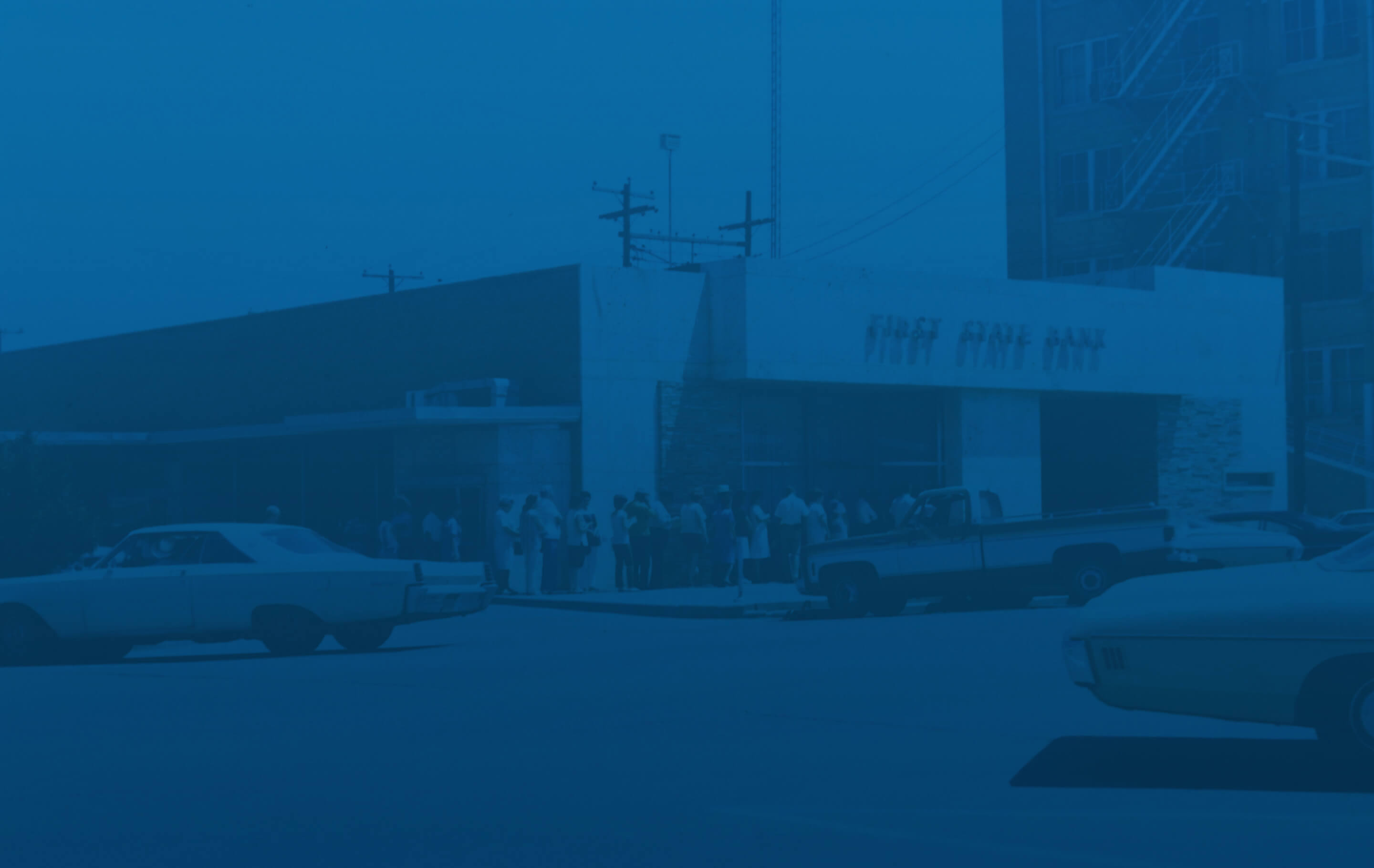 Background image: 1980s people lined up in front of a bank
