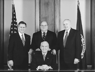 FDIC Board of Directors: Donald E. Powell, Chairman (seated), John M. Reich, John D. Hawke, Jr., James E. Gilleran (standing, left to right)