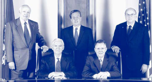 Donald E. Powell, Chairman, John M. Reich (seated), James E. Gilleran, Thomas L. Curry, and John D. Hawke, Jr., (standing, left to right)
