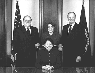 Photo: FDIC Board of Directors: Donna Tanoue (seated), John D. Hawke, Jr., Ellen Seidman, Andrew C. Hove, Jr. (standing left to right)