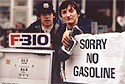 Photo at gas station with sign that says 'Sorry No Gasoline'
