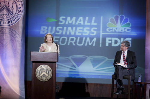 Karen G. Mills, Administrator of the Small Business Administration, gives closing remarks during the FDIC Overcoming Obstacles to Small Business Lending Forum.  CNBC Host and Moderator John Harwood is at right.