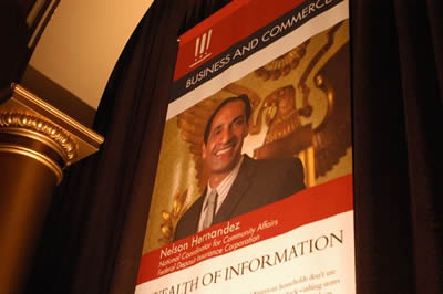 A banner in the main hall of the National Building Museum lauds Nelson Hernandez and the Community Affairs Team for their accomplishment in winning the Service to America Medal in the Business and Commerce category.