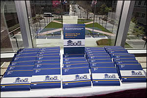 Information kits for attendees at registration desk.